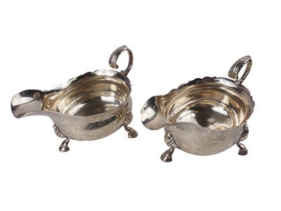 Lot 312 - Twin Sterling Silver Gravy Jugs.
