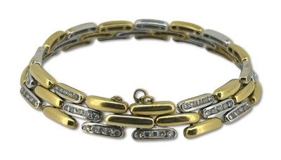 Lot 273 - Yellow and White Gold Diamond Bracelet.