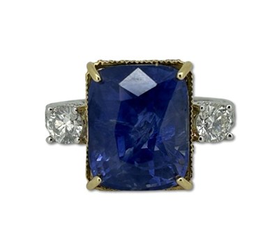 Lot 267 - Sapphire and Diamond Ring.
